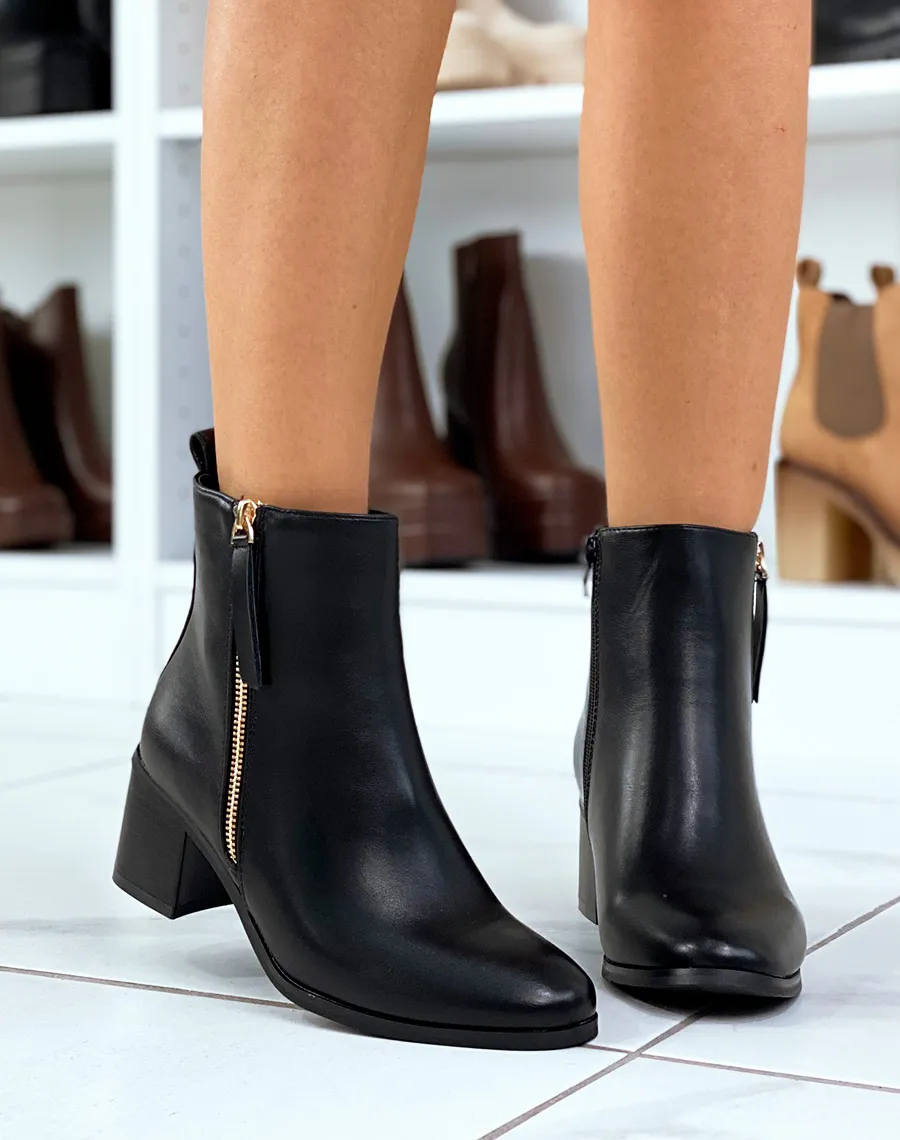 Black ankle boots with gold zip and low heel