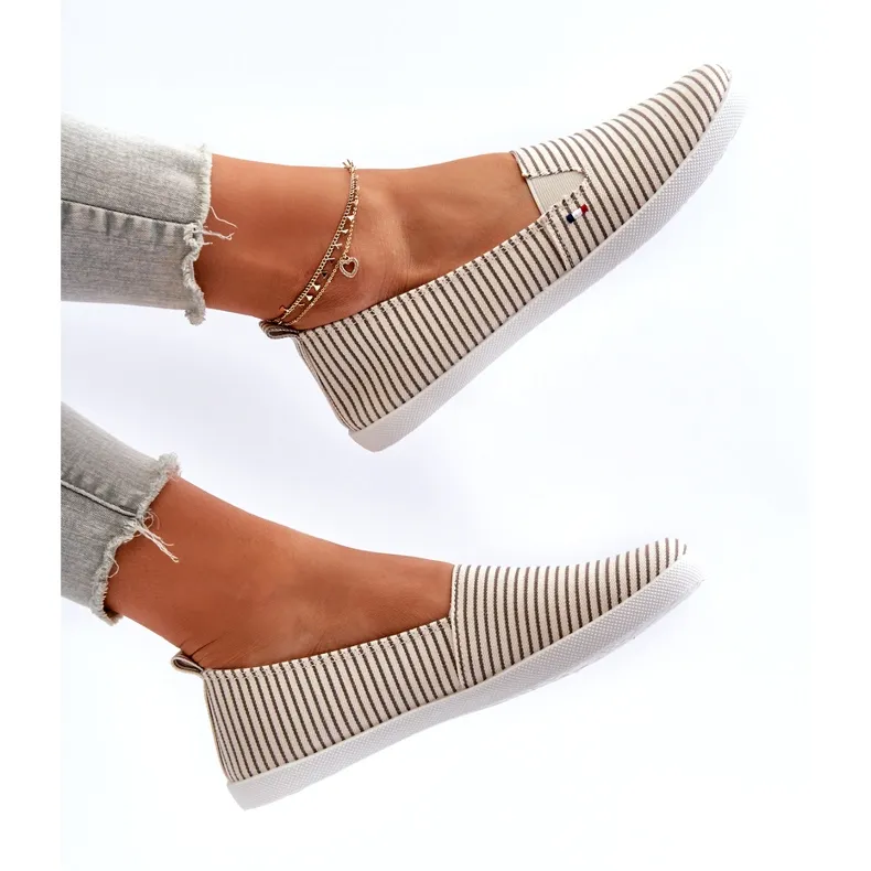 Striped Pazaria beige women's slip-on sneakers.